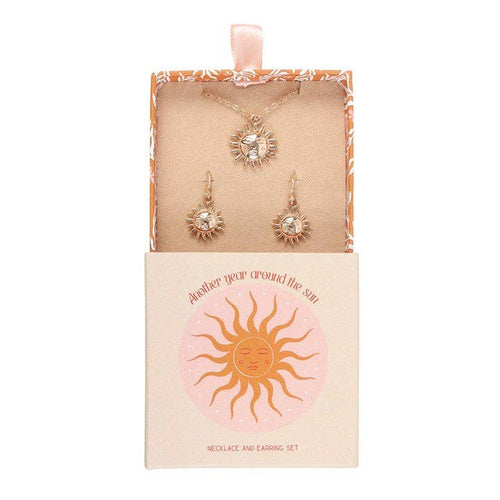 Conjunto de collar y pendientes con diseño de sol